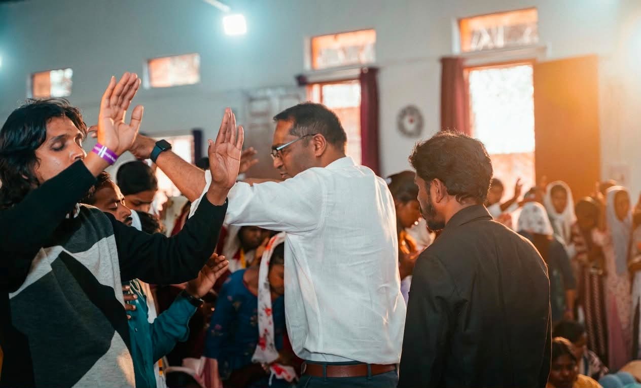 People celebrating at a TOLIM crusade